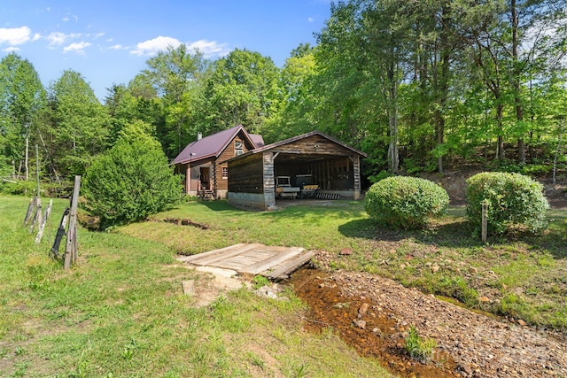 1154 Woodrow Pl, Lenoir, NC 28645 - view of grassy yard with a detached carport