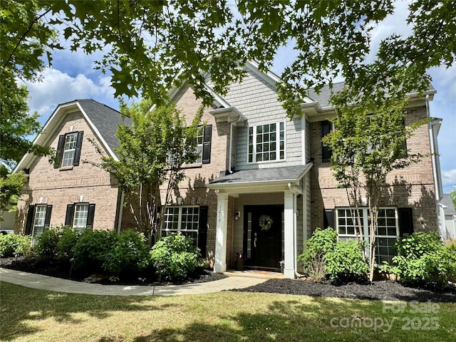 view of front of property featuring brick siding