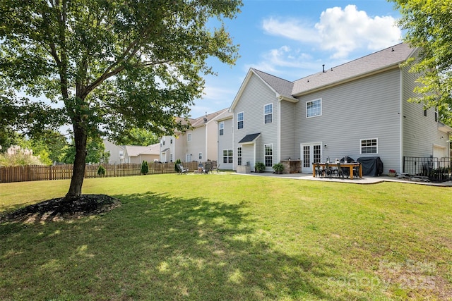 back of property featuring a patio and french doors
