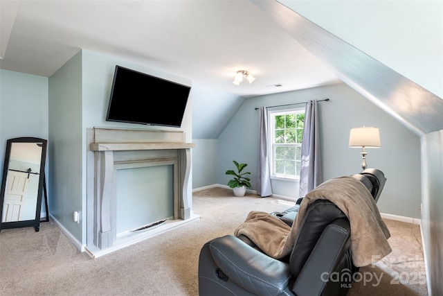 living room with light carpet, lofted ceiling, and baseboards