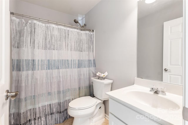 bathroom featuring vanity, toilet, curtained shower, and tile patterned flooring