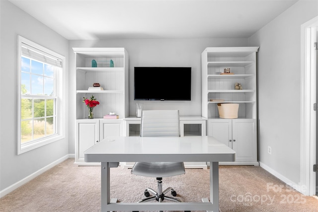 office featuring light colored carpet and baseboards