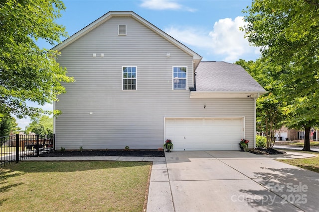 view of side of property featuring driveway