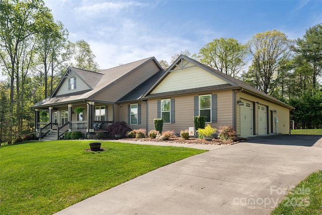 craftsman inspired home with a garage, a front lawn, covered porch, a shingled roof, and driveway
