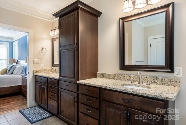full bathroom with crown molding, tile patterned flooring, ensuite bath, and vanity
