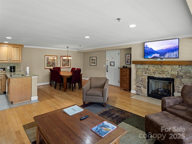 401 Bowling Park Rd, Asheville, NC 28803 - living area with ornamental molding, a notable chandelier, light wood-style flooring, and baseboards