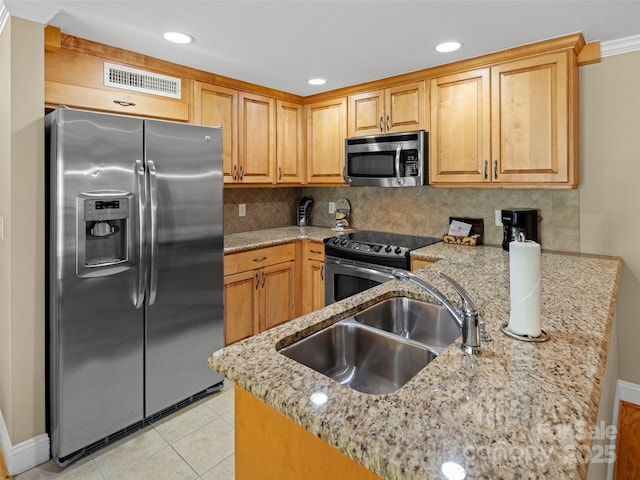 401 Bowling Park Rd, Asheville, NC 28803 - kitchen with light stone countertops, a sink, tasteful backsplash, visible vents, and appliances with stainless steel finishes
