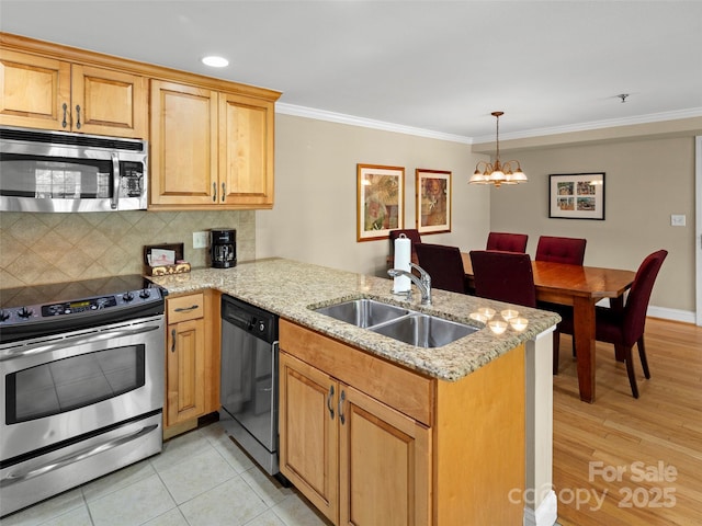 401 Bowling Park Rd, Asheville, NC 28803 - kitchen featuring an inviting chandelier, a sink, a peninsula, ornamental molding, and appliances with stainless steel finishes