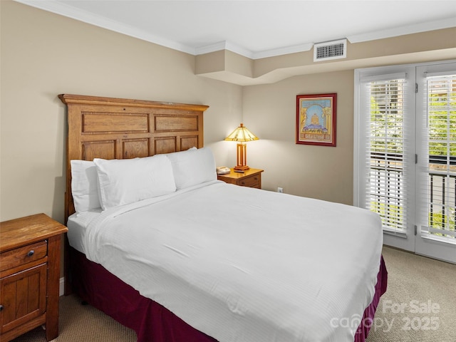 401 Bowling Park Rd, Asheville, NC 28803 - bedroom with visible vents, ornamental molding, access to exterior, and light carpet