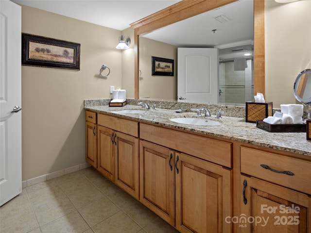 401 Bowling Park Rd, Asheville, NC 28803 - bathroom with double vanity, visible vents, tile patterned flooring, and a sink