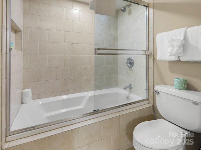 401 Bowling Park Rd, Asheville, NC 28803 - bathroom featuring tiled shower / bath combo and toilet