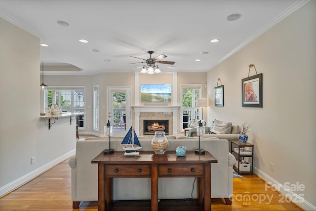 7471 Barfield Ln, Denver, NC 28037 - living room featuring ceiling fan, baseboards, a lit fireplace, recessed lighting, and light wood-style flooring