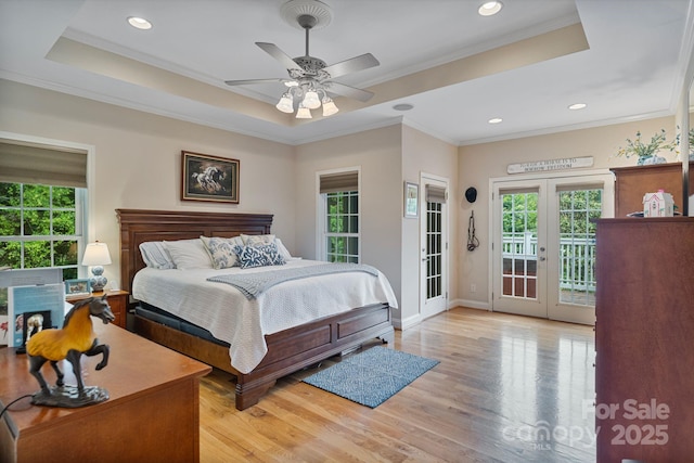 7471 Barfield Ln, Denver, NC 28037 - bedroom with access to exterior, a tray ceiling, multiple windows, ornamental molding, and recessed lighting