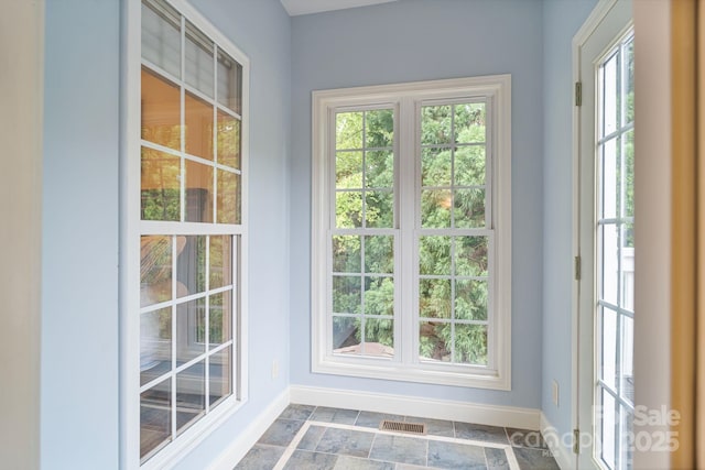 7471 Barfield Ln, Denver, NC 28037 - doorway to outside featuring baseboards