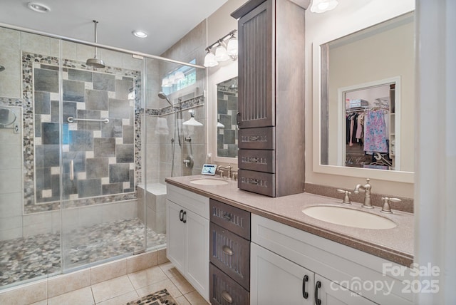 7471 Barfield Ln, Denver, NC 28037 - bathroom with double vanity, a shower stall, tile patterned flooring, a walk in closet, and recessed lighting