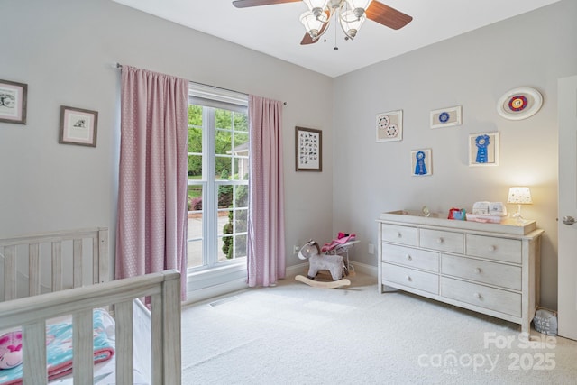 7471 Barfield Ln, Denver, NC 28037 - bedroom with a nursery area, light colored carpet, ceiling fan, and baseboards