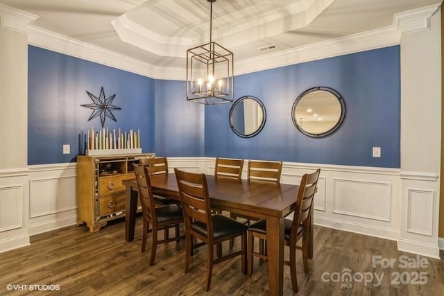 876 Hardin St Unit B24, Lancaster, SC 29720 - dining area featuring a chandelier, wood finished floors, a decorative wall, a wainscoted wall, and a raised ceiling