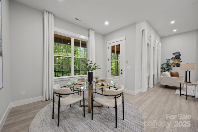 dining room with recessed lighting, visible vents, baseboards, and light wood-style floors