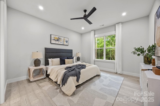 bedroom featuring baseboards, recessed lighting, ceiling fan, and light wood-style floors