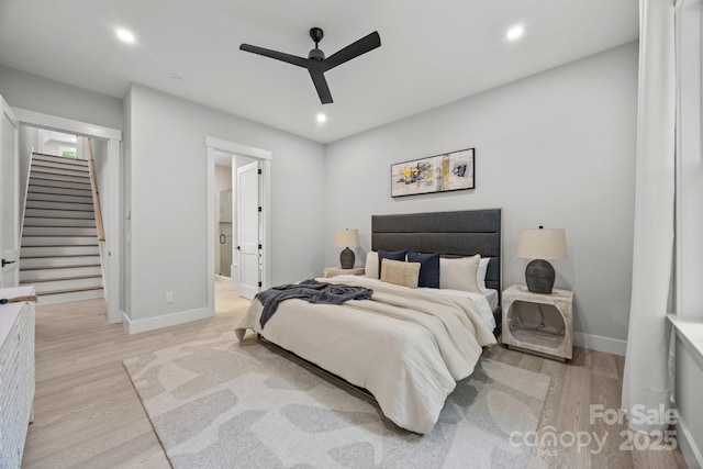 bedroom featuring recessed lighting, a ceiling fan, light wood-style flooring, and baseboards