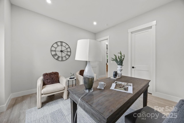 office space featuring baseboards, recessed lighting, and light wood-style flooring