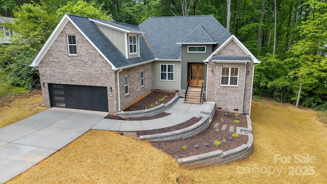 view of front of house featuring brick siding, roof with shingles, concrete driveway, and an attached garage