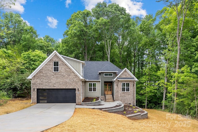 view of front of property with driveway, brick siding, and a garage