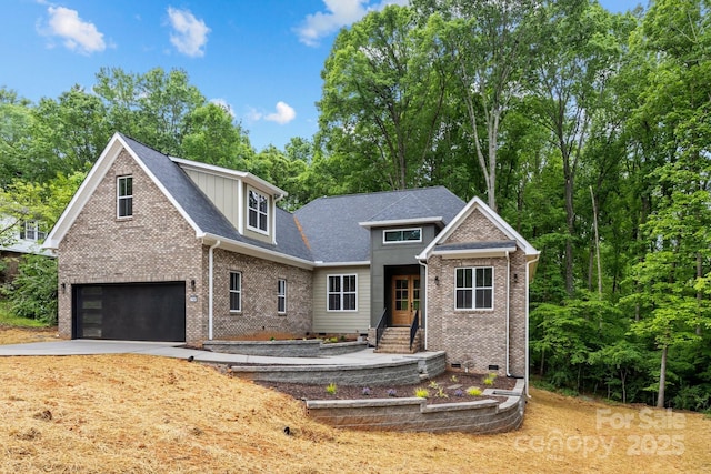 view of front facade featuring concrete driveway, brick siding, and an attached garage