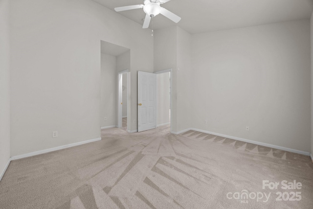 8313 Carob Tree Ln, Charlotte, NC 28215 - carpeted empty room featuring baseboards and a ceiling fan
