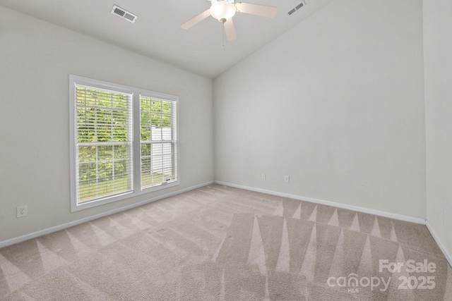 8313 Carob Tree Ln, Charlotte, NC 28215 - spare room featuring vaulted ceiling, carpet flooring, a ceiling fan, and baseboards