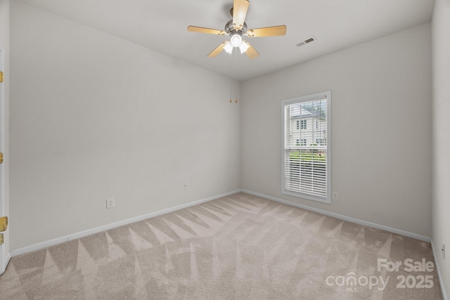 8313 Carob Tree Ln, Charlotte, NC 28215 - spare room with light colored carpet, baseboards, and ceiling fan