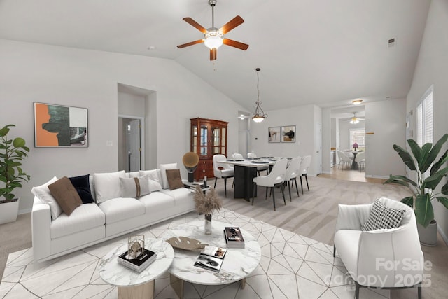 8313 Carob Tree Ln, Charlotte, NC 28215 - living room with ceiling fan, lofted ceiling, light colored carpet, and baseboards