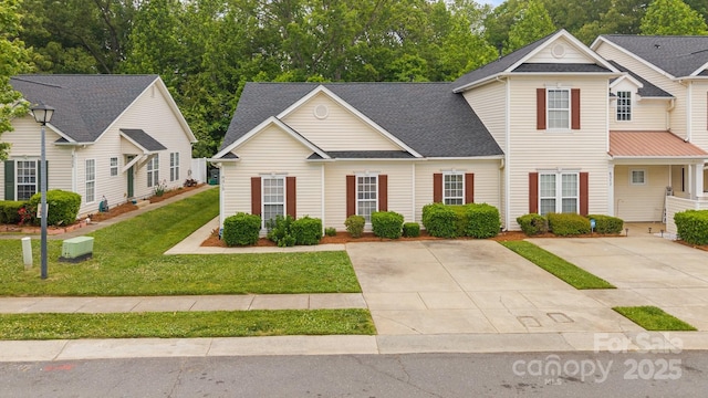 8313 Carob Tree Ln, Charlotte, NC 28215 - traditional-style home with a front yard and roof with shingles