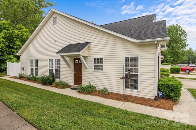 8313 Carob Tree Ln, Charlotte, NC 28215 - view of front of property featuring a shingled roof and a front lawn
