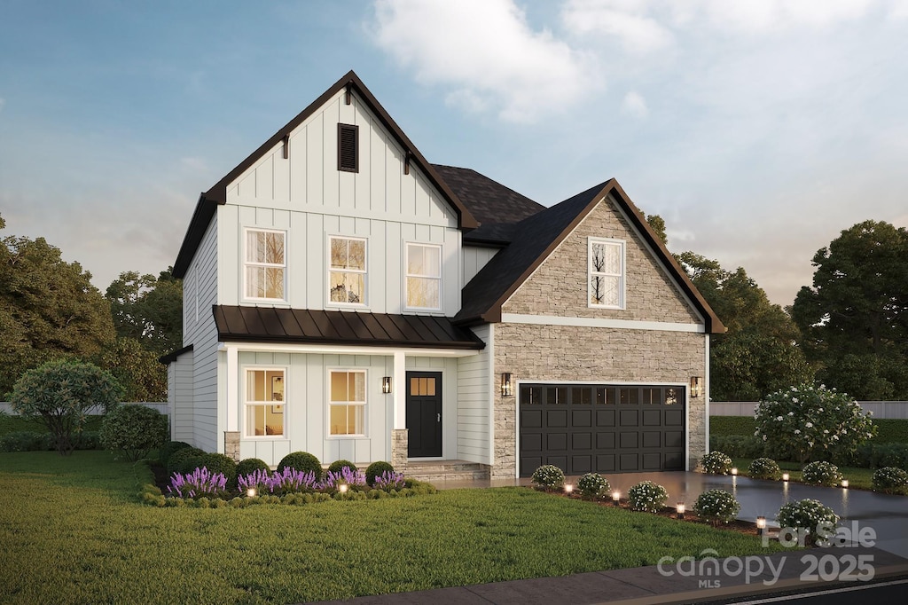 modern inspired farmhouse with board and batten siding, stone siding, a standing seam roof, a front yard, and a garage