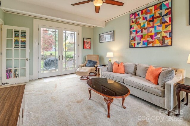 living room featuring french doors, carpet, and ceiling fan