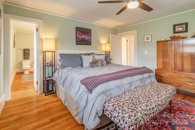 bedroom featuring light wood-type flooring, a ceiling fan, and ornamental molding