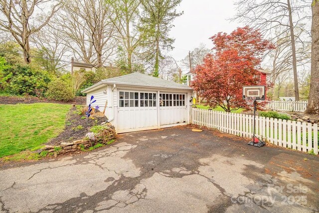 garage with fence