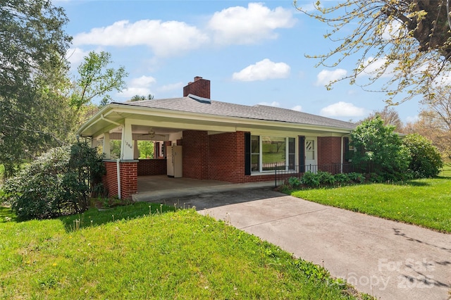 1294 Beaverdam Rd, Canton, NC 28716 - ranch-style house featuring a front yard, a chimney, brick siding, a porch, and driveway