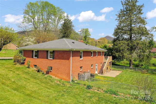 1294 Beaverdam Rd, Canton, NC 28716 - view of property exterior with brick siding, a fenced backyard, stairs, and a yard
