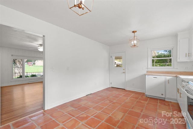1294 Beaverdam Rd, Canton, NC 28716 - kitchen with dishwasher, light countertops, light tile patterned floors, white cabinets, and electric stove