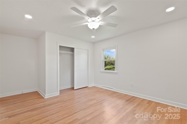 1294 Beaverdam Rd, Canton, NC 28716 - unfurnished bedroom with a closet, baseboards, recessed lighting, a ceiling fan, and light wood-style flooring