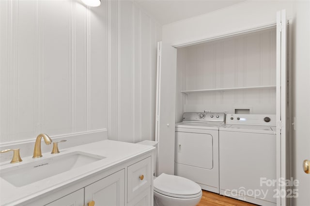 1294 Beaverdam Rd, Canton, NC 28716 - bathroom featuring toilet, washing machine and dryer, and vanity