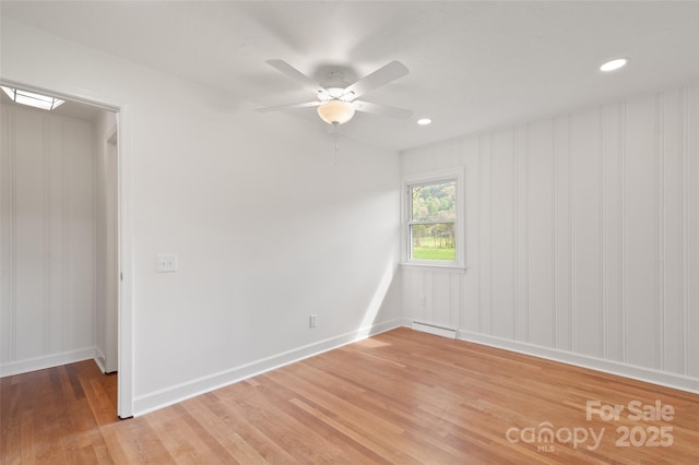 1294 Beaverdam Rd, Canton, NC 28716 - unfurnished room with light wood-style floors, baseboards, ceiling fan, and baseboard heating