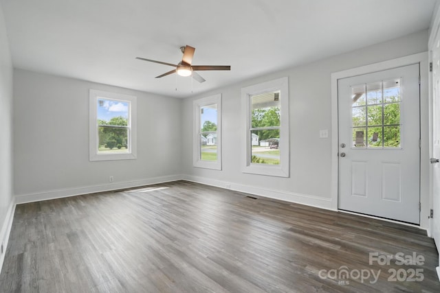 410 E 17th St, Kannapolis, NC 28083 - interior space featuring visible vents, baseboards, wood finished floors, and ceiling fan