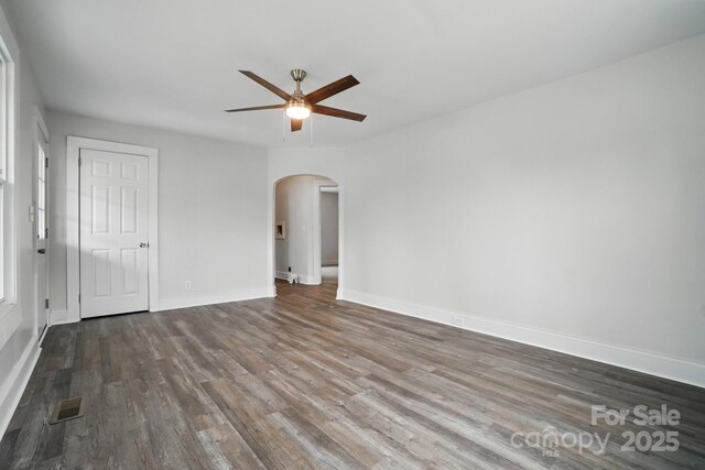 410 E 17th St, Kannapolis, NC 28083 - interior space with arched walkways, a ceiling fan, wood finished floors, and baseboards