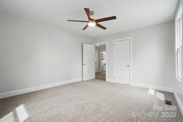 410 E 17th St, Kannapolis, NC 28083 - unfurnished bedroom with baseboards and carpet