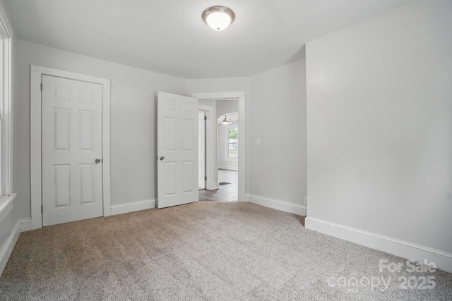 410 E 17th St, Kannapolis, NC 28083 - unfurnished bedroom featuring carpet and baseboards