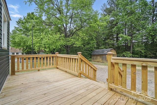 410 E 17th St, Kannapolis, NC 28083 - deck featuring an outdoor structure and a shed