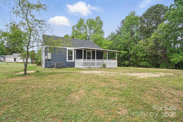 410 E 17th St, Kannapolis, NC 28083 - view of front of home with a front lawn and cooling unit